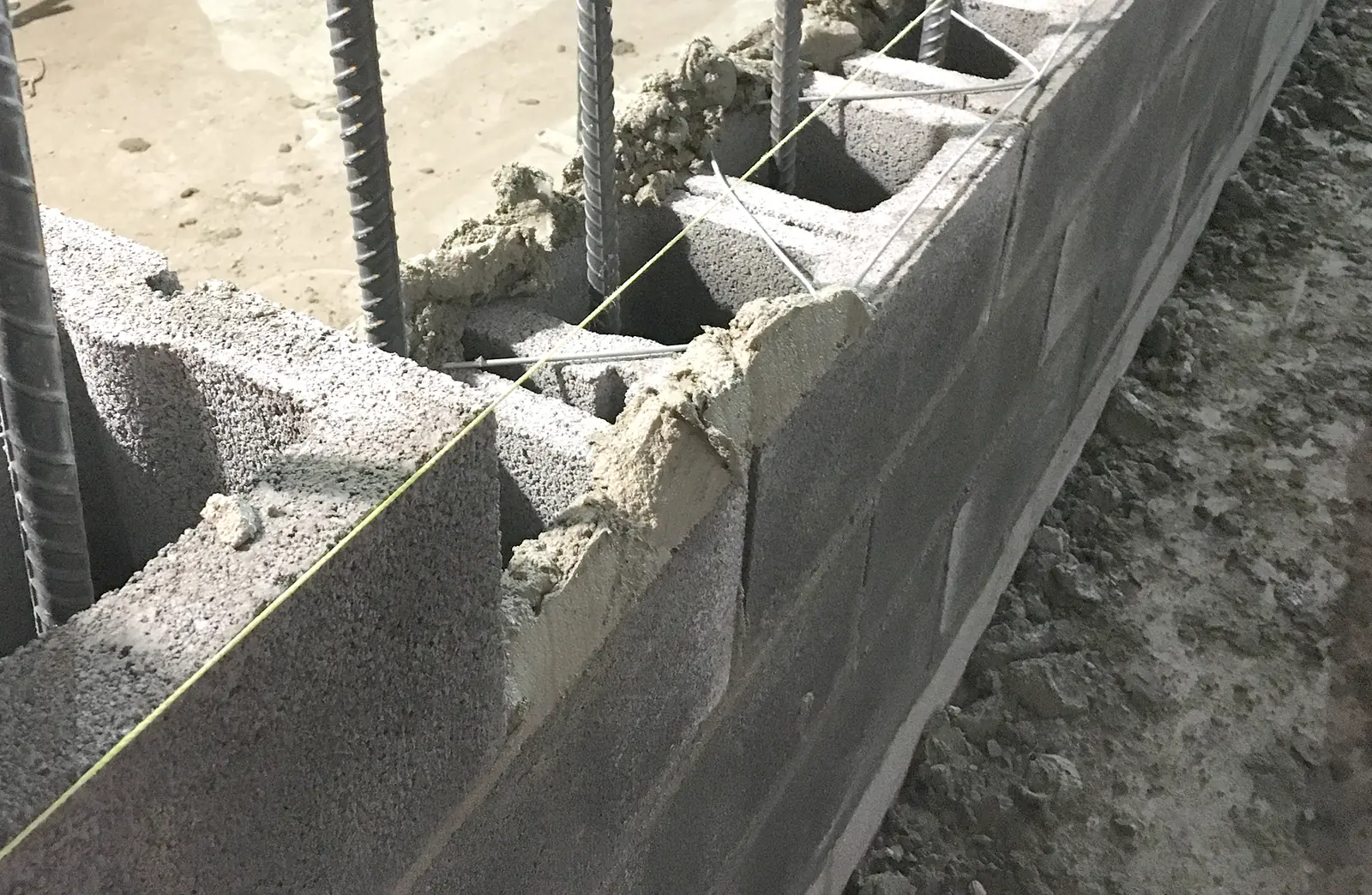 Close-up of concrete masonry units with mortar joints and open cells